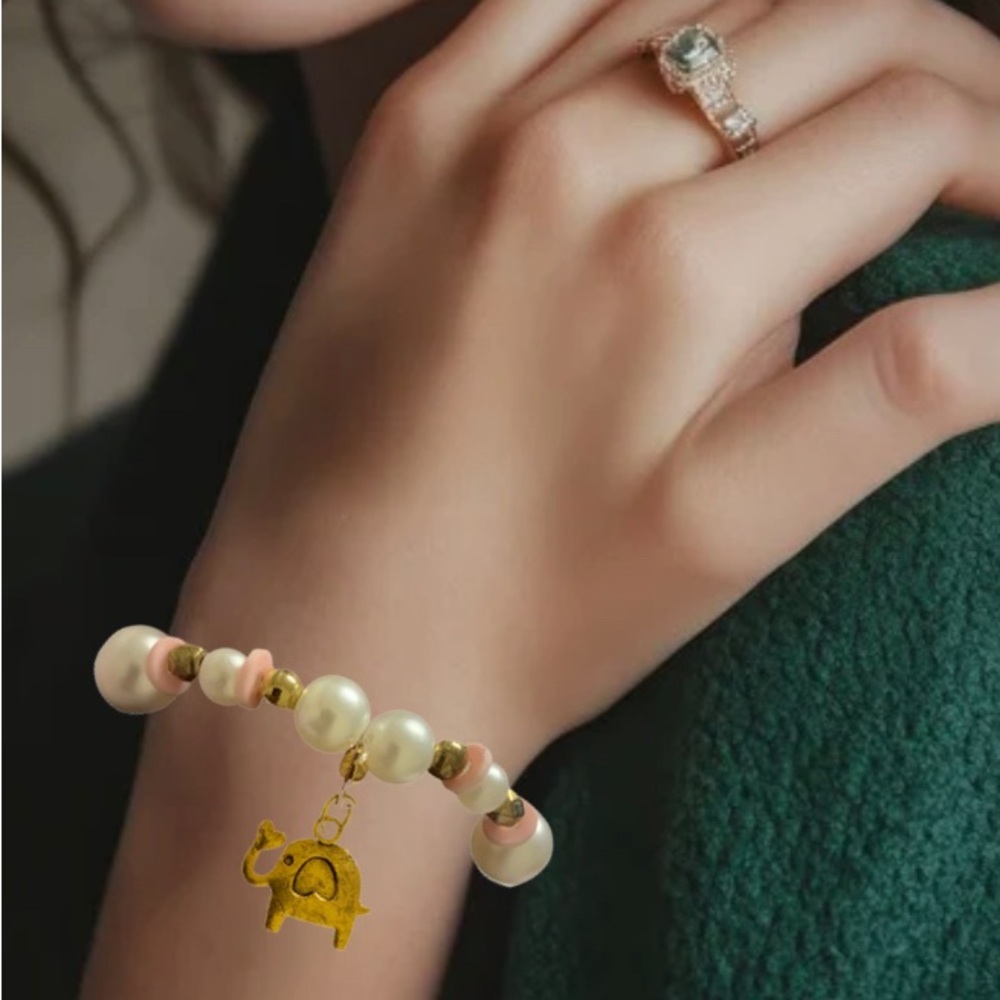 Elegant Pearl and Gold Elephant Charm Bracelet